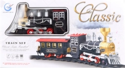 Klassieke treinbaan met rokende locomotief