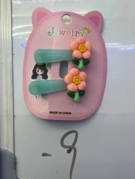 Haarclip met oranje bloem