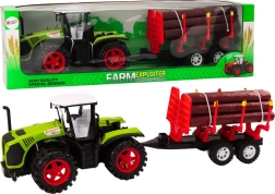 Groene boerderijtractor met aanhanger voor boomstammen