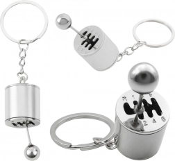 Metalen sleutelhanger in de vorm van een versnellingsbak, zilverkleurig