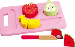 Small Foot slicing fruit on a cutting board