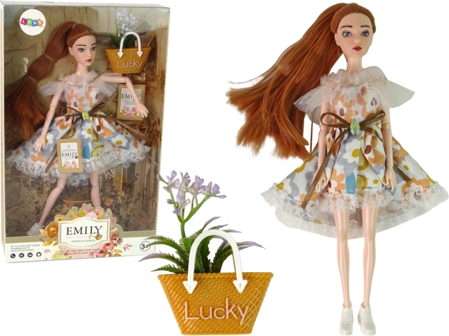 Emily doll in floral dress with autumn accessory