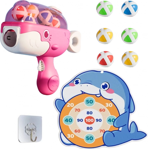Pink children's ball gun with velcro and whale-shaped target