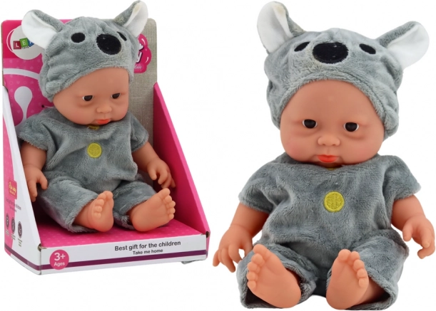 Small baby doll in a gray koala outfit with hat