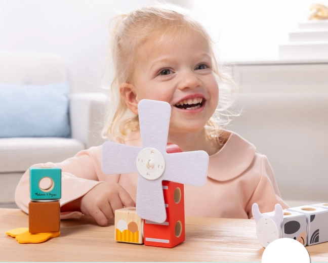 Interactive windmill and playful farm motifs