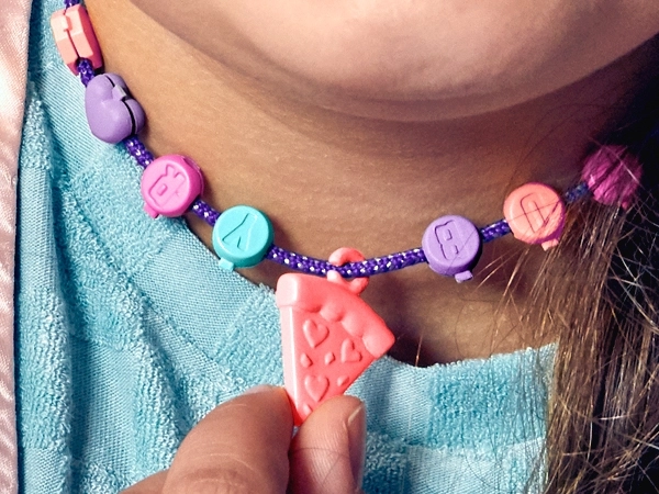 Styling, beads, and pizza charm