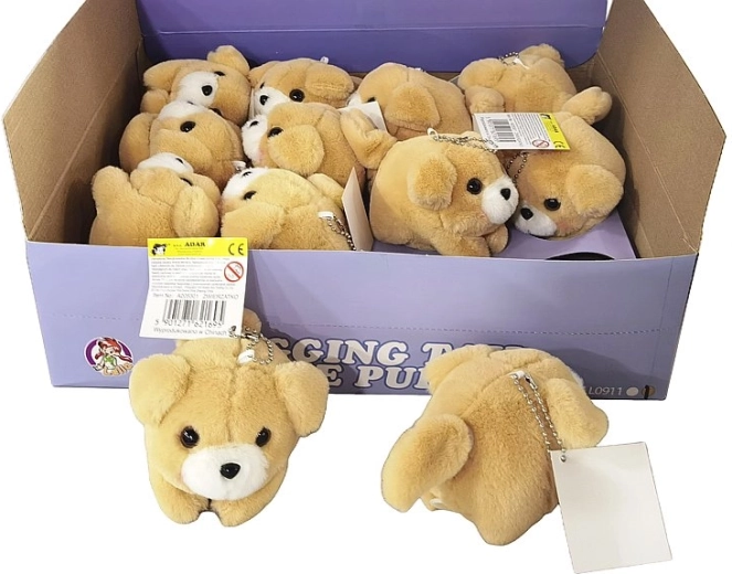 Plush dog with wind-up mechanism that wags its tail