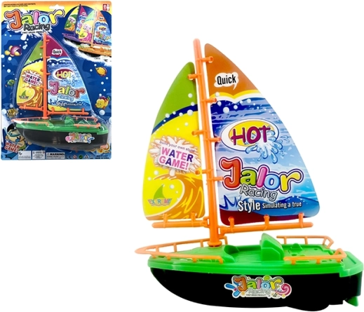 Floating colorful battery-powered sailboat