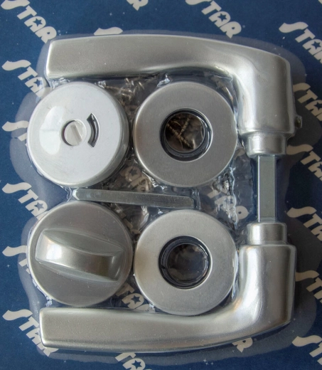 Ferrure à rosace de porte MONET WC, aluminium anodisé argent