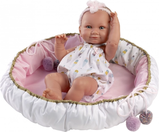 Bébé en vinyle 40 cm Nica dans un panier doux