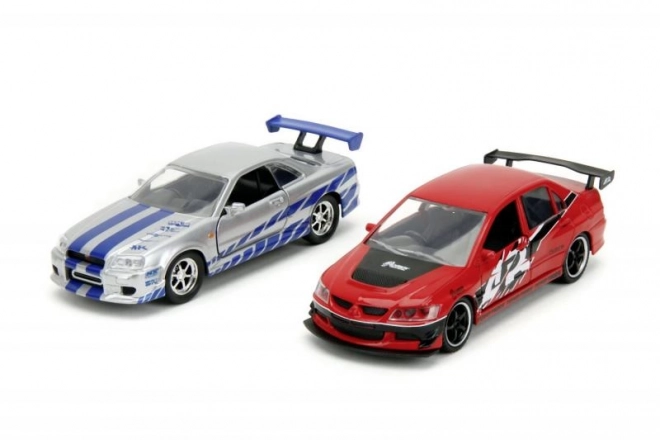 Fast en Furious Twin Pack 2006 Mitsubishi Lancer Evo IX + Brian's 2002 Nissan Skyline GTR R34, 1:32 Wave 4/2