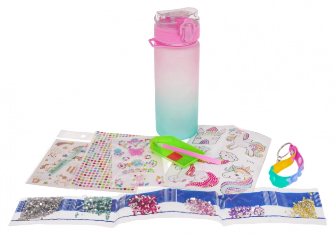 Fles met eenhoorn en accessoires