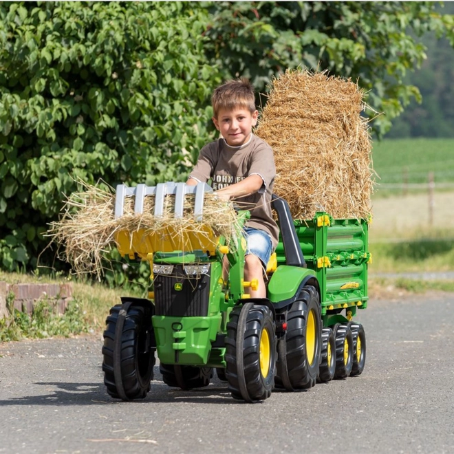 Pelle pour tracteur avec prise pour le chargement du bois