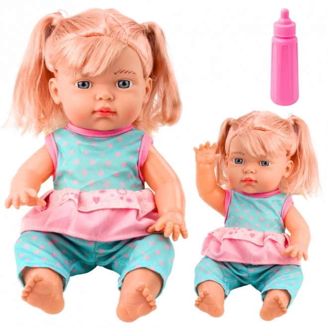 Poppenbaby in turquoise set met flesje en geluid