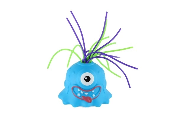 Monstre avec ventouse en plastique 7cm fonctionnant avec des piles avec son, lumière 3 couleurs en boîte de 12 pièces