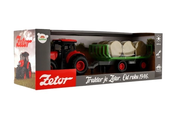 Tractor Zetor met aanhanger en plastic balen 36cm op vliegwiel op batterij met licht en geluid in doos 39x13