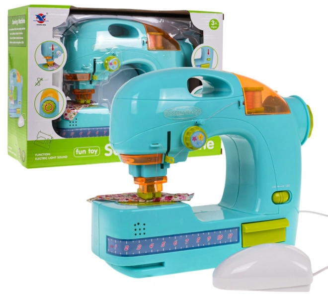 Blauwe naaimachine + accessoires