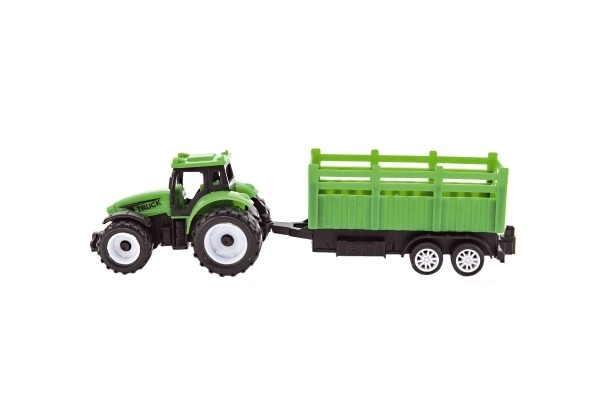 Tractor met aanhanger van plastic 21cm vrij lopend 2 kleuren in doosje 23x9x6cm