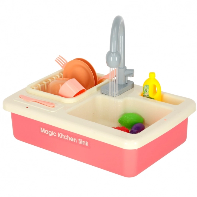 Kinderkeuken gootsteen met echt water en roze accessoires