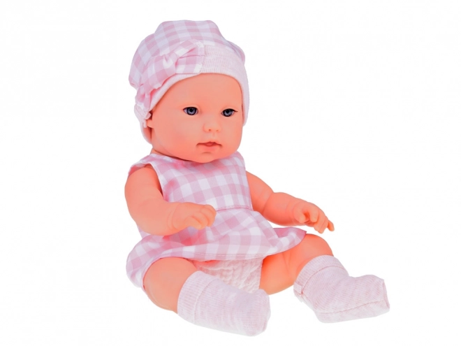 Stoffen paspop pasgeborene met roze muts