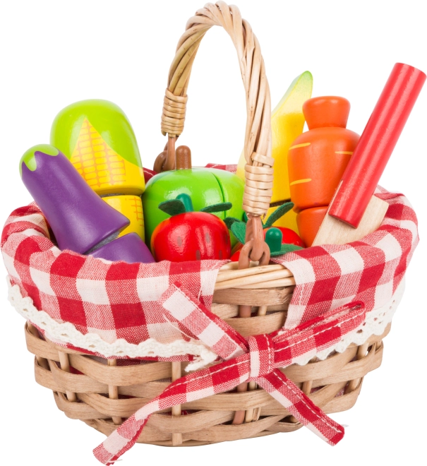 Realistic wicker basket with wooden groceries