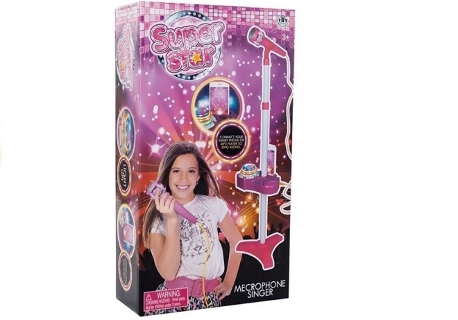 Roze set met microfoon, statief en projector