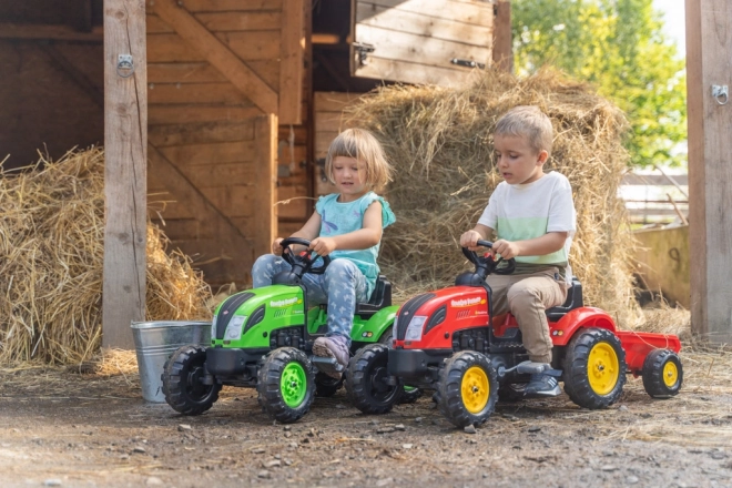 Rode kindertrapper met aanhanger
