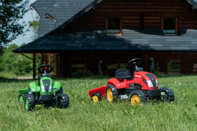 Rode kindertrapper met aanhanger