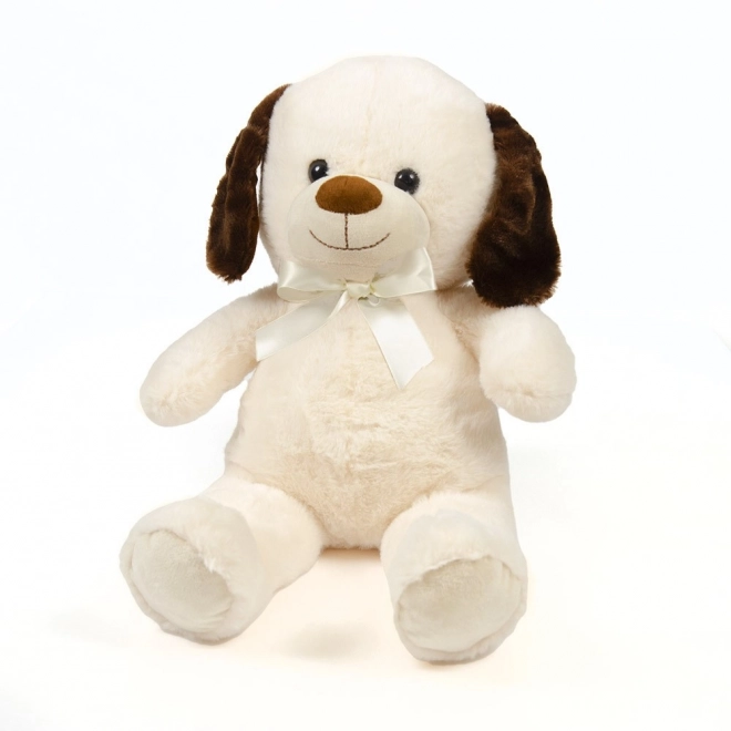 Zittende beige knuffelhondje