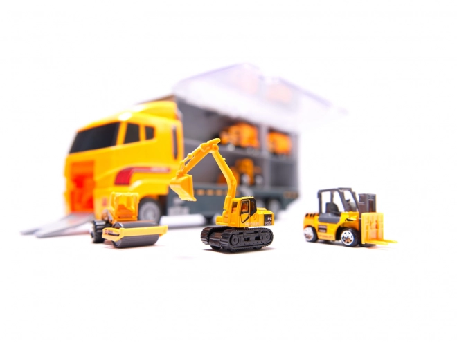 Camion avec petits véhicules de construction