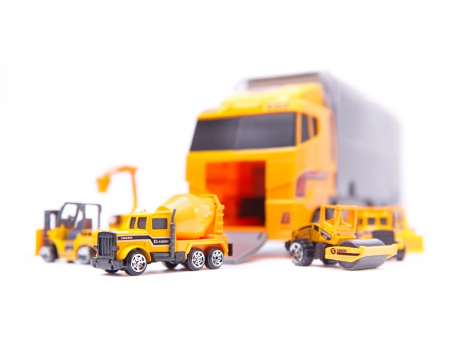 Camion avec petits véhicules de construction