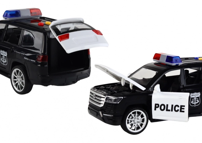 Politiewagen met effecten, open deuren en schaal 1:14