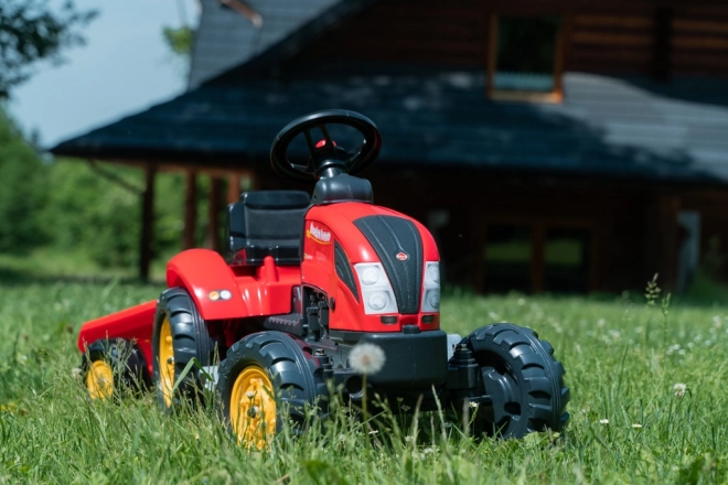 Rode kindertrapper met aanhanger