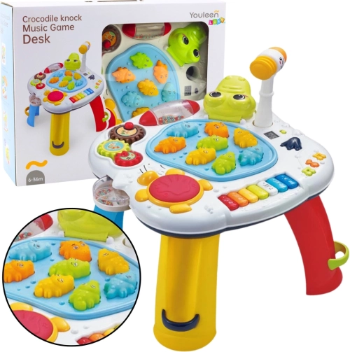 Interactive educational table with piano, drum, and crocodile