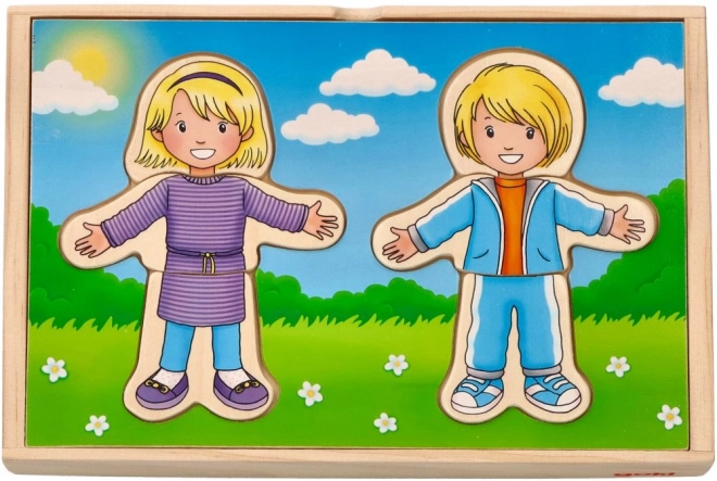 Houten puzzel voor kinderen Kleden met jongen en meisje