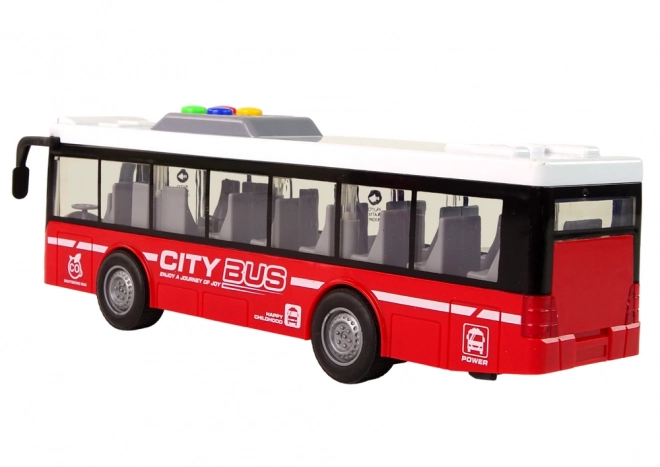 Interactieve groene bus op batterijen met frictieaandrijving 1:16 – Rood