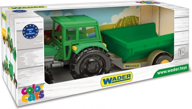 Farm tractor with trailer in a cardboard box