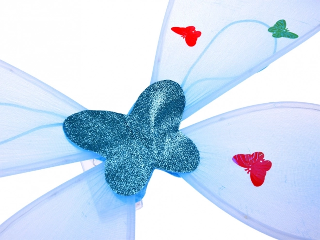 Lichtgevende blauwe kostuum voor een klein elfje met vlindervleugels