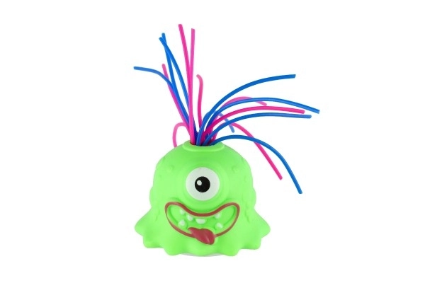 Monstre avec ventouse en plastique 7cm fonctionnant avec des piles avec son, lumière 3 couleurs en boîte de 12 pièces