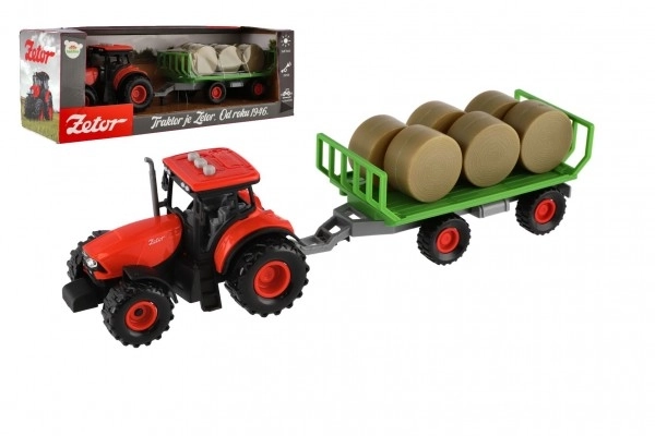 Tractor Zetor met aanhanger en plastic balen 36cm op vliegwiel op batterij met licht en geluid in doos 39x13