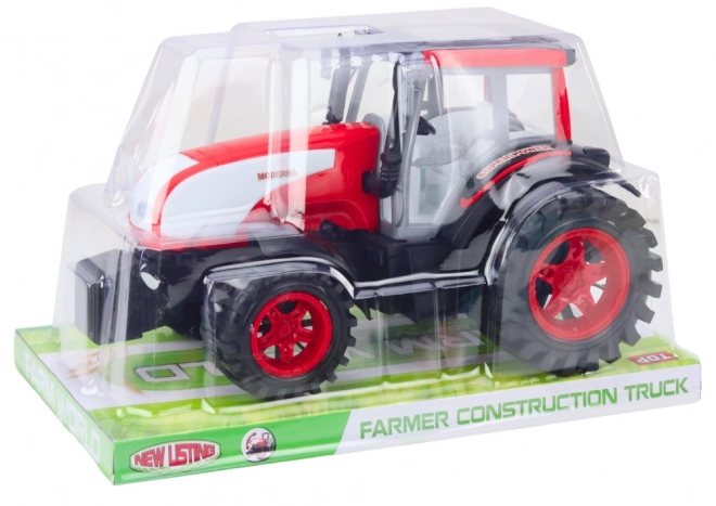 Grand tracteur agricole rouge à entraînement