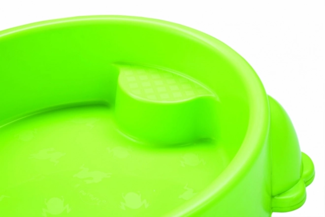 Plastic zandbak in de vorm van een kikker met groen deksel