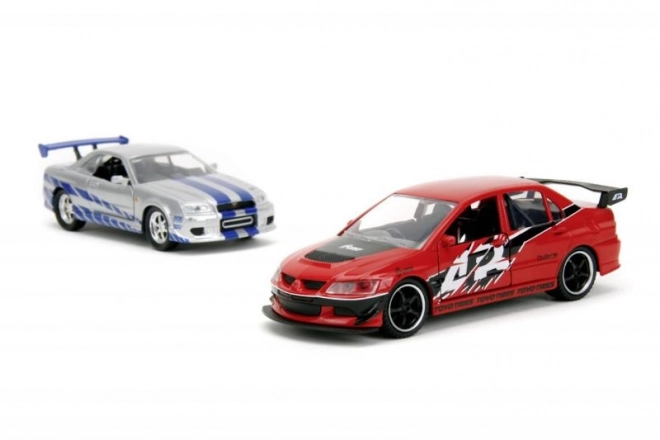Fast en Furious Twin Pack 2006 Mitsubishi Lancer Evo IX + Brian's 2002 Nissan Skyline GTR R34, 1:32 Wave 4/2