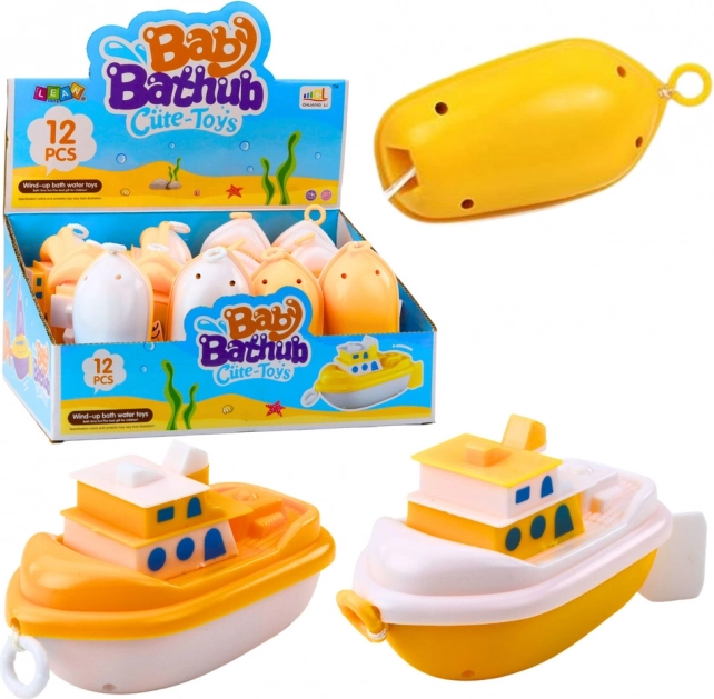 Jouet de bain bateau à remontoir blanc et jaune