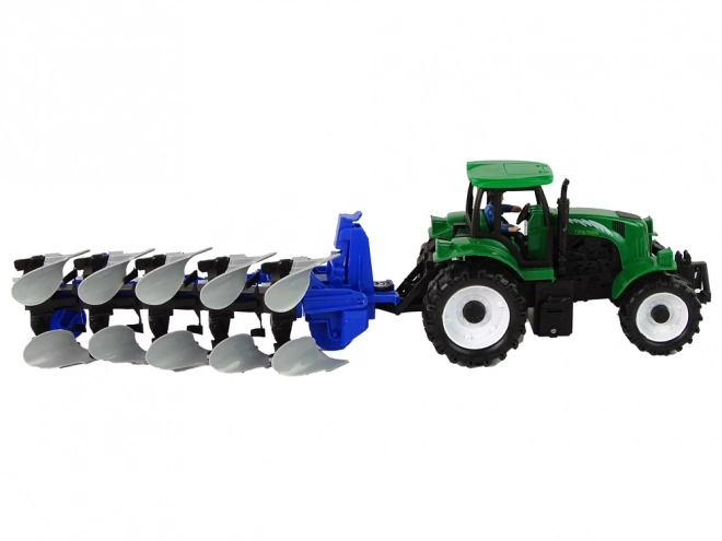 Groene landbouwtractor met ploeg