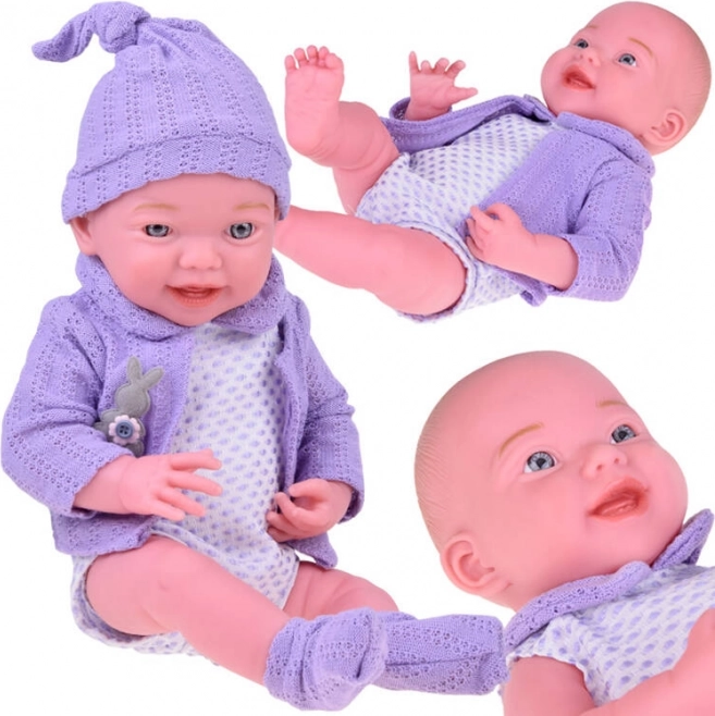 Smiling baby doll 40 cm with purple cardigan