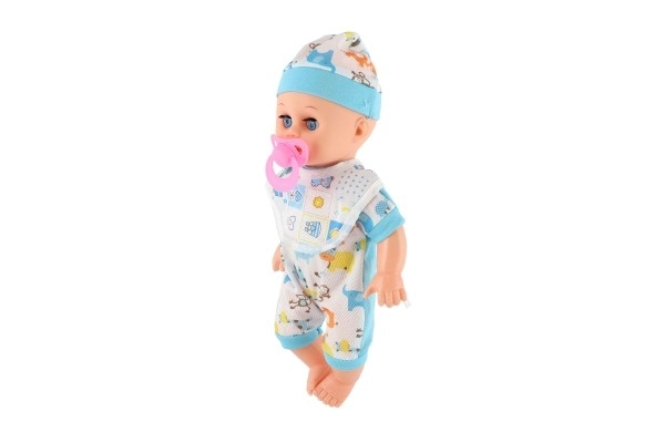 Poupée bébé plastique 32cm corps solide buvant, faisant pipi à piles avec son et accessoires dans un sac