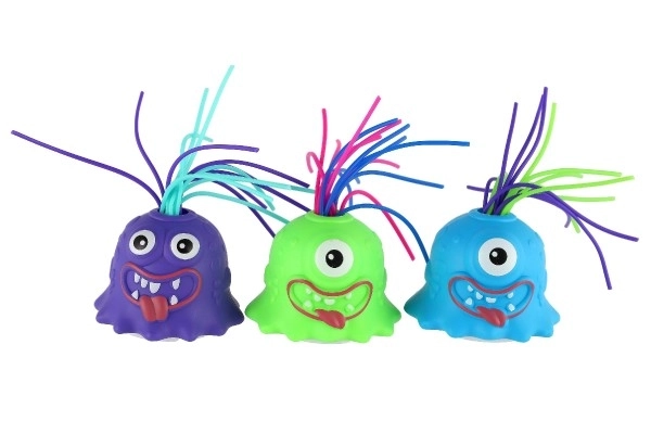 Monstre avec ventouse en plastique 7cm fonctionnant avec des piles avec son, lumière 3 couleurs en boîte de 12 pièces
