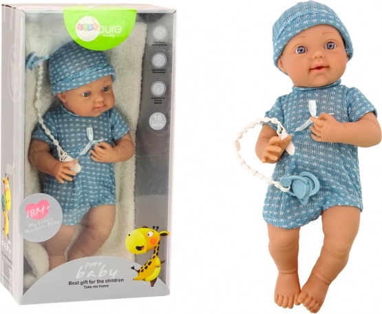 Baby doll in blue outfit with hat and pacifier
