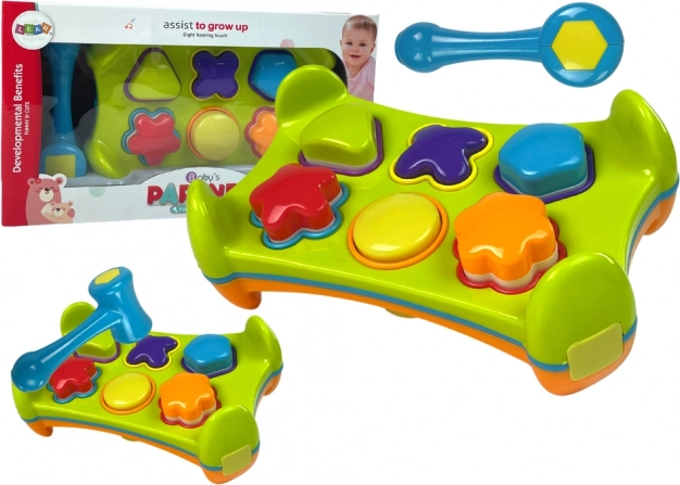 Double-sided educational shape sorter with hammer and shapes